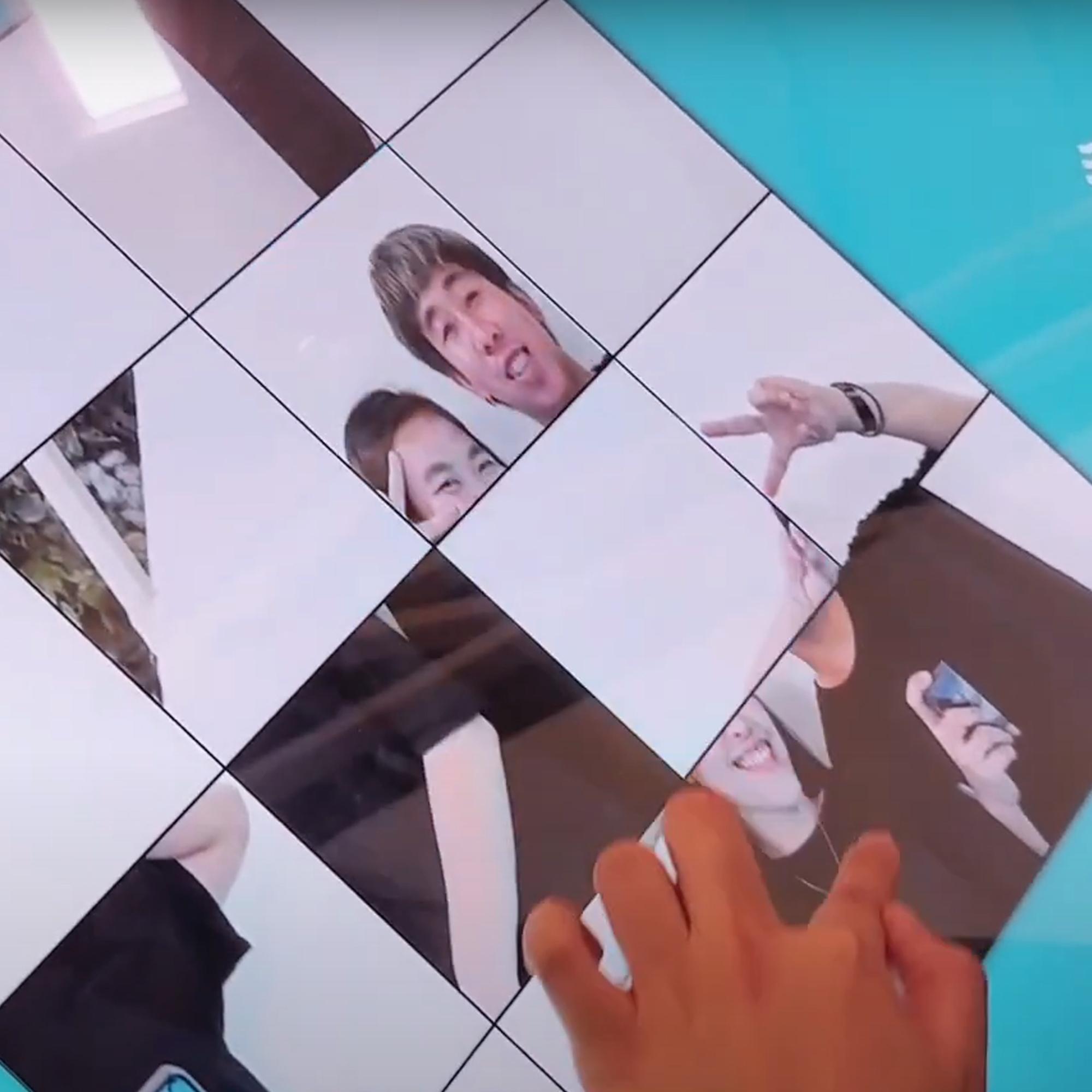 Player solving a shuffled photo puzzle of their face during an interactive event challenge.