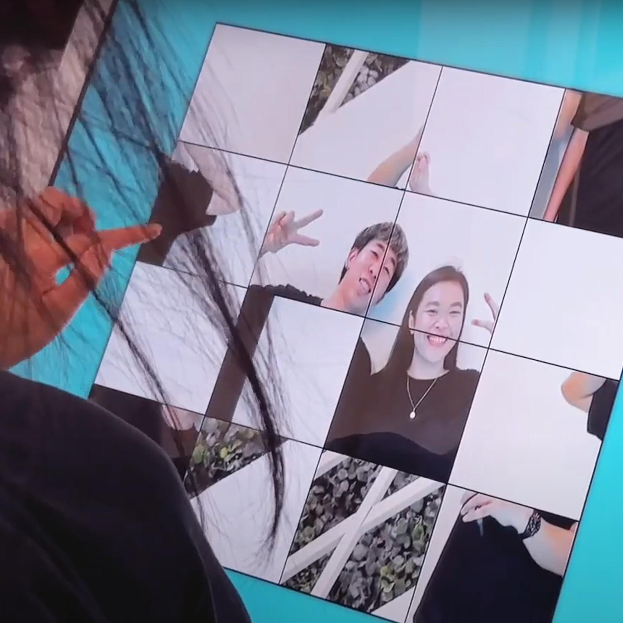 Player solving a shuffled photo puzzle of their face during an interactive event challenge.