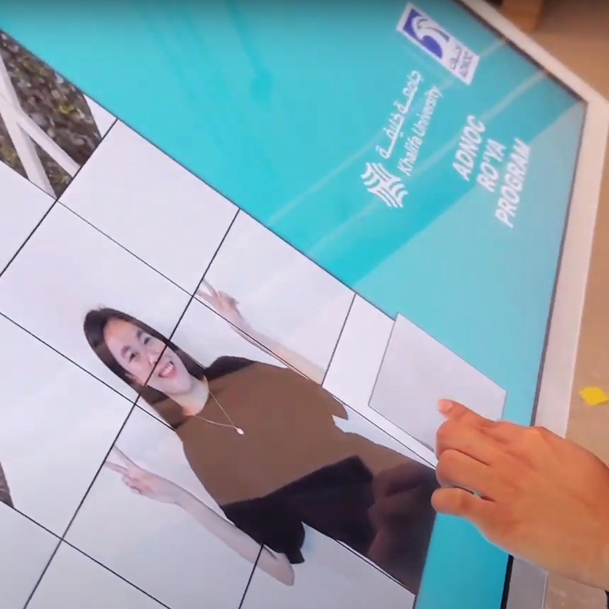 Player solving a shuffled photo puzzle of their face during an interactive event challenge.