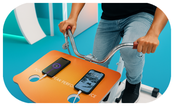 Guests competing to recharge their devices at a Recharge Station Challenge event, with branded stations and high-energy fun.